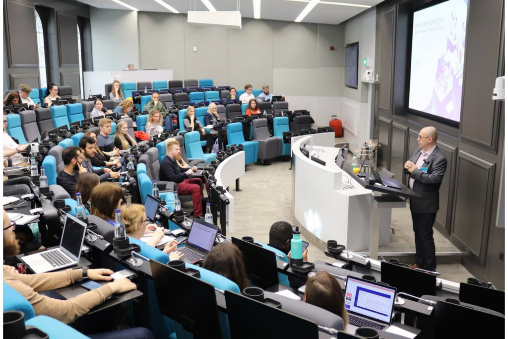 Speaker presenting at the UX Healthcare conference