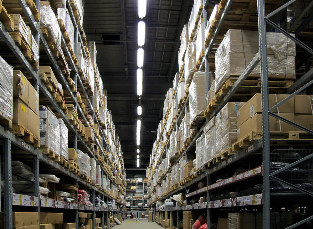 warehouse shelves filled with items and boxes
